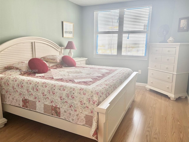 bedroom with light hardwood / wood-style flooring