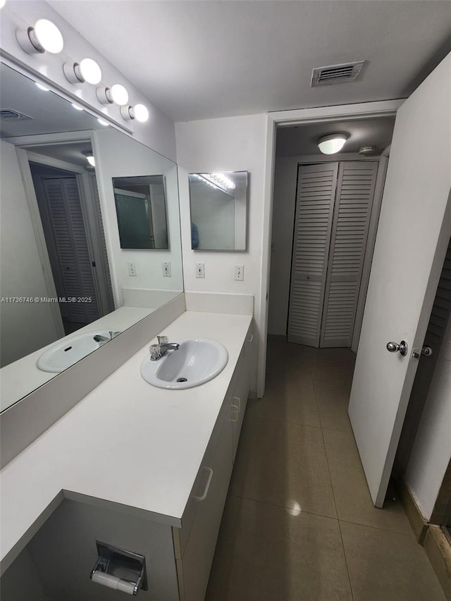 bathroom with vanity and tile patterned floors