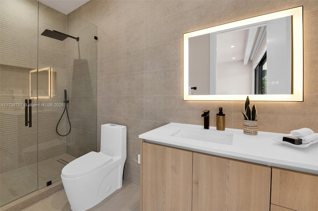 bathroom featuring vanity, tile walls, toilet, and walk in shower