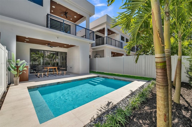 view of pool with a patio and ceiling fan