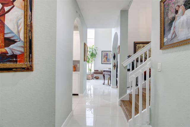 corridor with light tile patterned floors