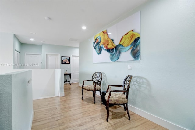 living area with light hardwood / wood-style floors