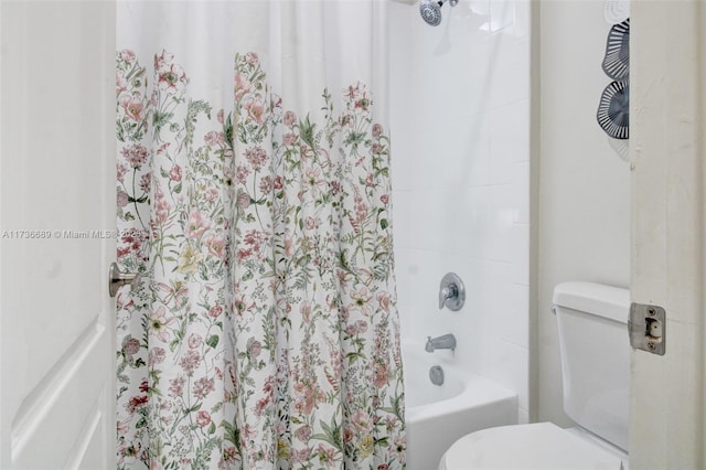 bathroom with shower / bath combination with curtain and toilet