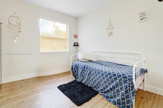 bedroom featuring hardwood / wood-style flooring