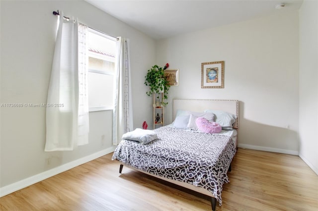 bedroom featuring wood-type flooring