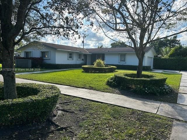 single story home featuring a front yard