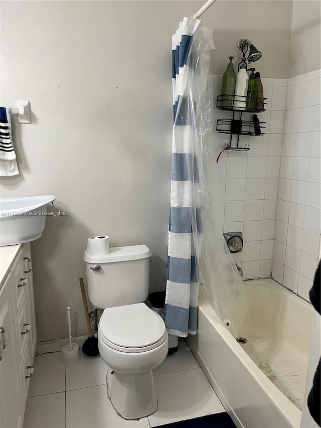 full bathroom featuring tile patterned flooring, vanity, shower / bath combination with curtain, and toilet