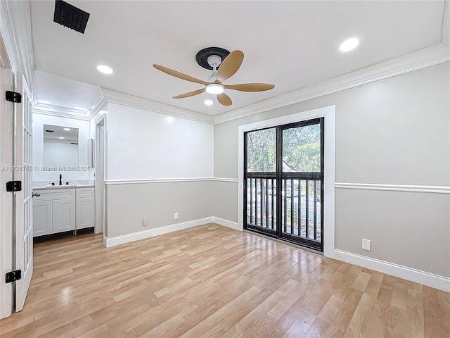 unfurnished bedroom featuring crown molding, access to outside, and light wood-type flooring