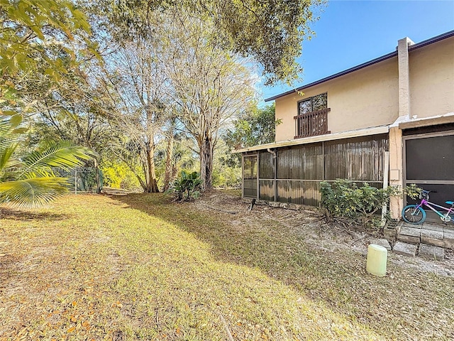 view of yard with a sunroom