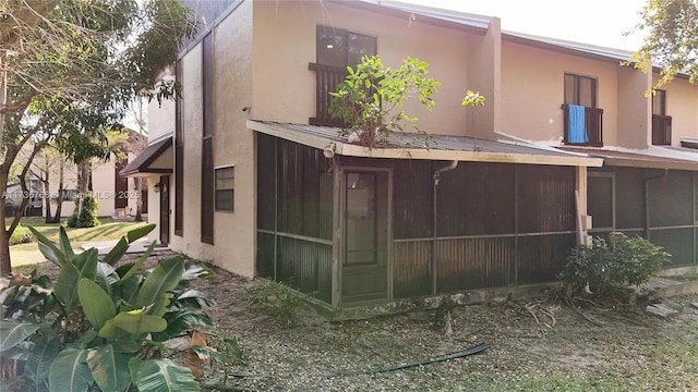 view of home's exterior featuring a sunroom