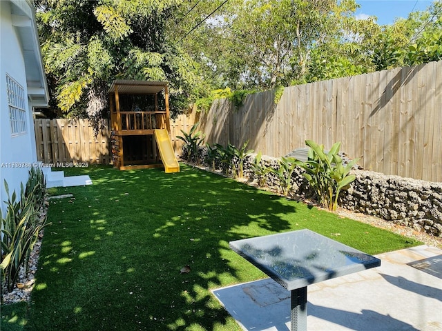 view of yard with a playground