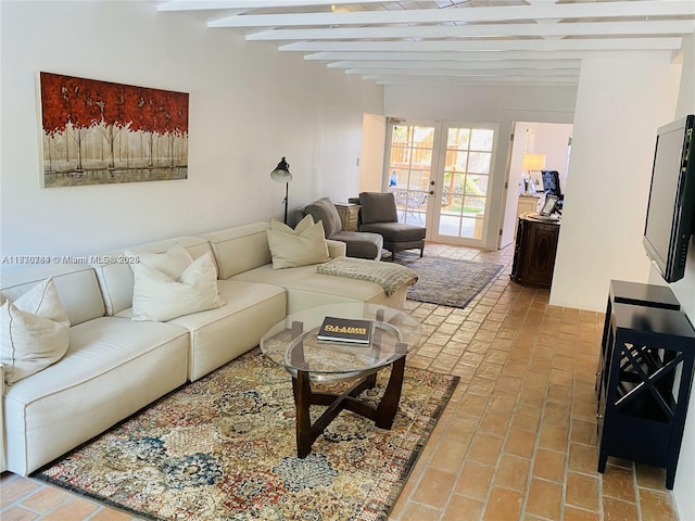 living room with beamed ceiling and french doors