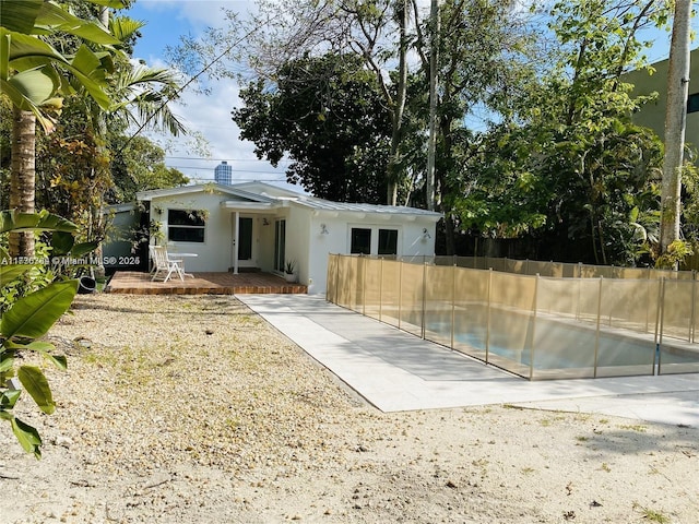 back of property with a patio area