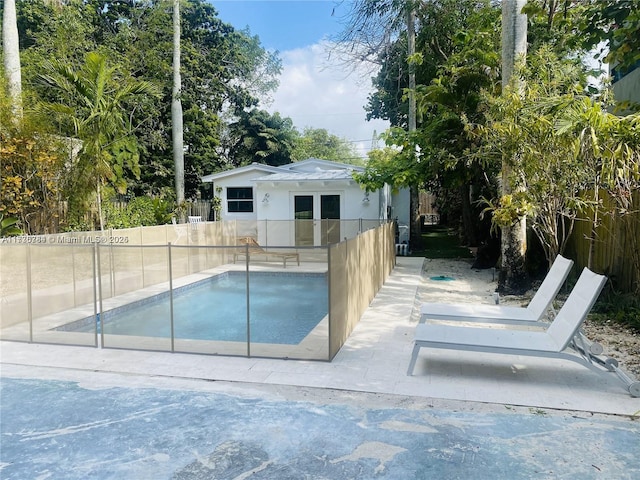 view of swimming pool with an outdoor structure