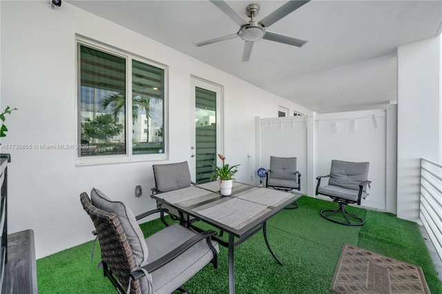 view of patio / terrace featuring ceiling fan