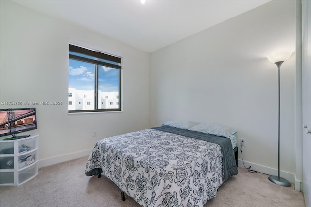 bedroom with light colored carpet