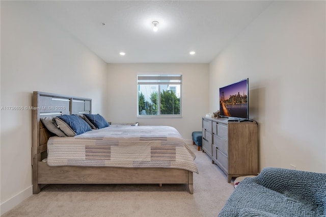 bedroom featuring light carpet