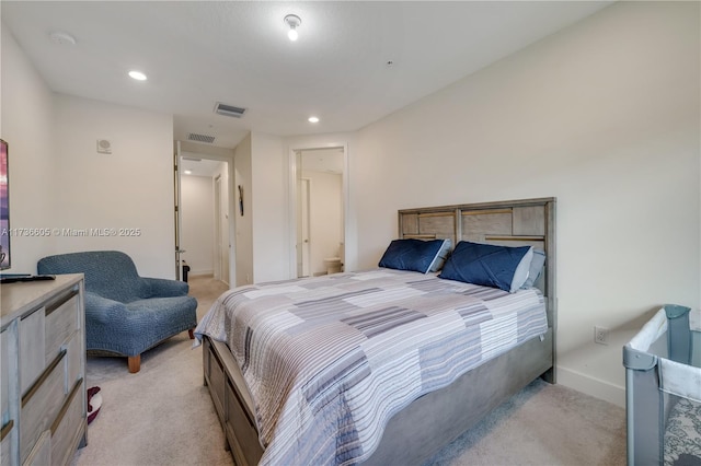 bedroom with light carpet