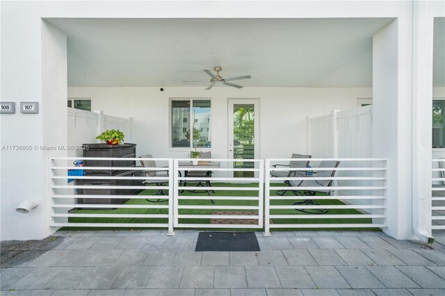 exterior space with ceiling fan