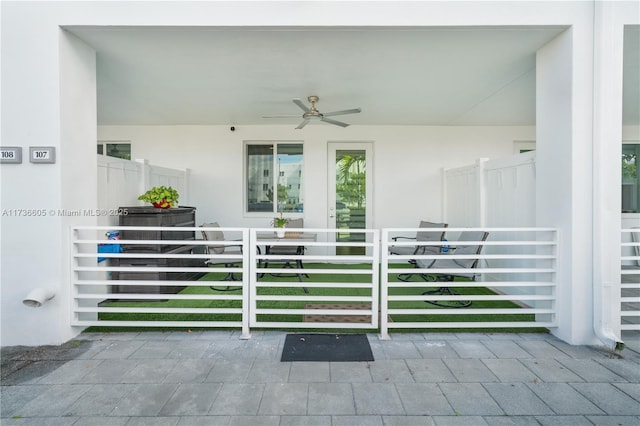 exterior space featuring ceiling fan