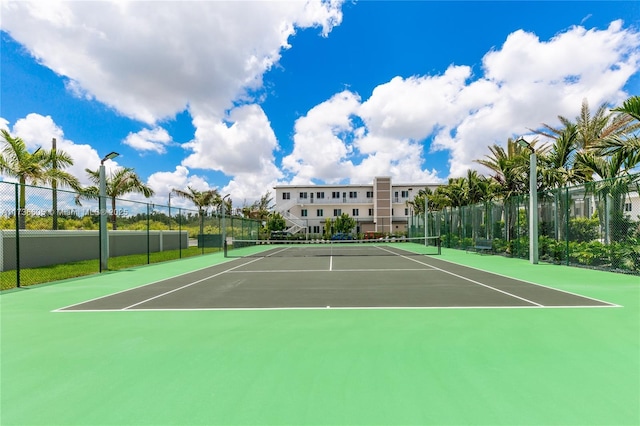 view of sport court with basketball hoop