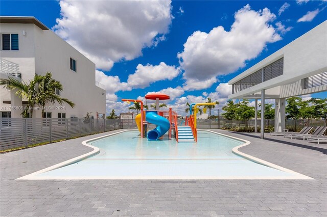 view of pool featuring a playground