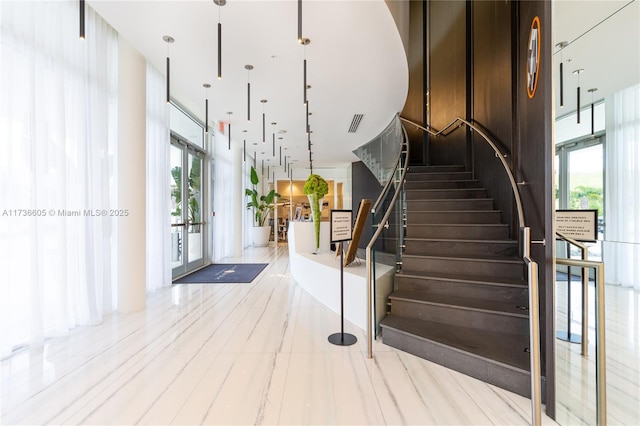 stairs featuring a wealth of natural light