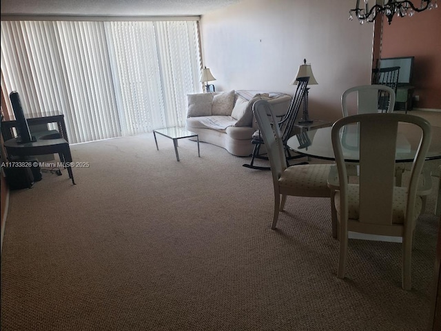 carpeted living area featuring a chandelier and expansive windows