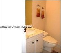 bathroom with vanity and toilet