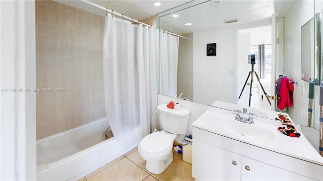 full bathroom featuring vanity, shower / bathtub combination with curtain, tile patterned floors, and toilet