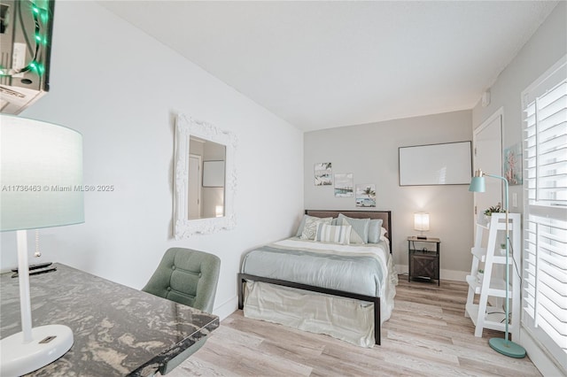 bedroom featuring light wood-type flooring