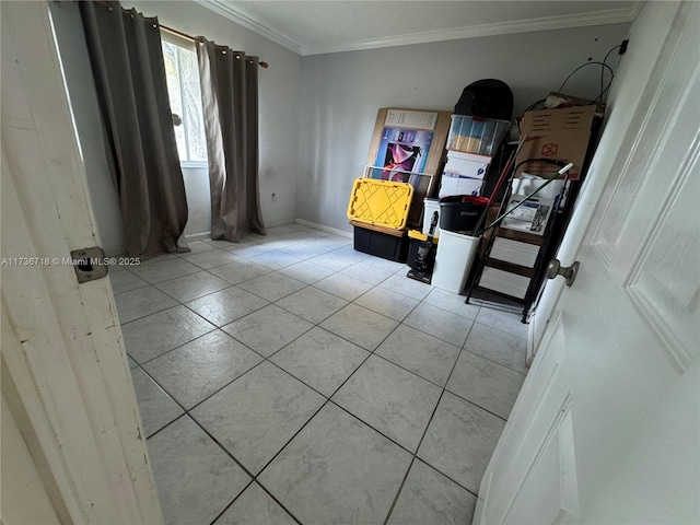 interior space with tile patterned floors and ornamental molding