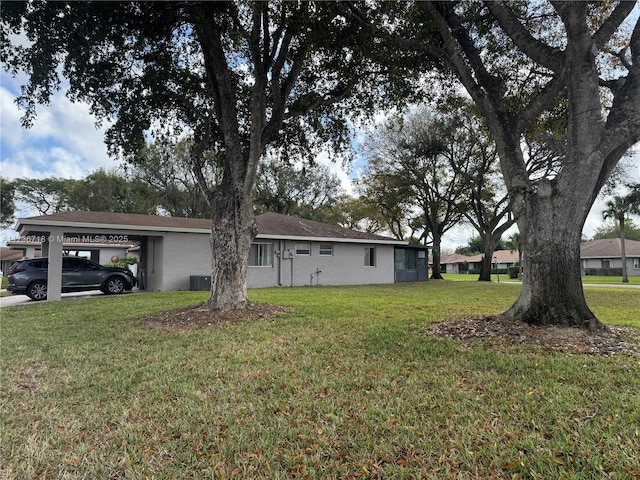 exterior space featuring a carport and central AC unit