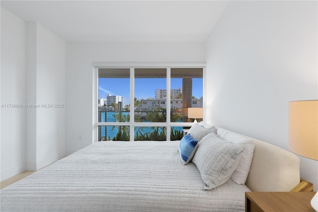 bedroom featuring a water view