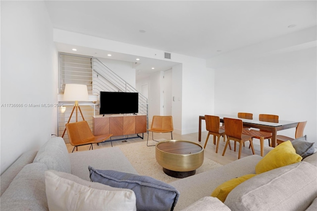 living room with light hardwood / wood-style flooring