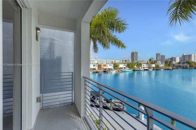 balcony featuring a water view