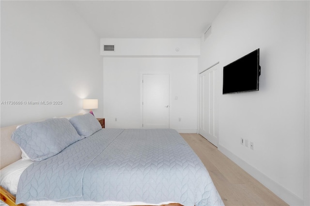 bedroom with light hardwood / wood-style floors