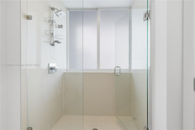 bathroom with a shower with shower door