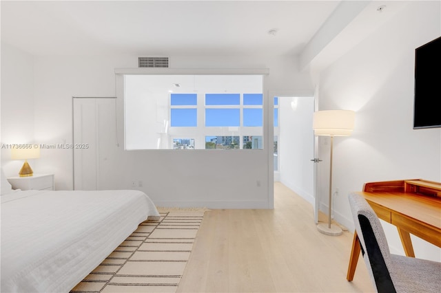 bedroom featuring light wood-type flooring