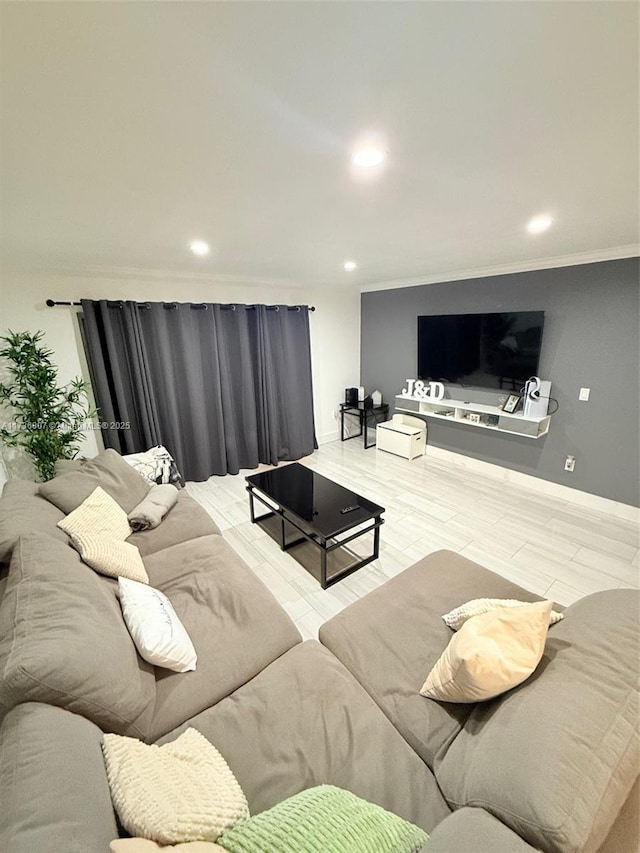 living room featuring crown molding and hardwood / wood-style floors