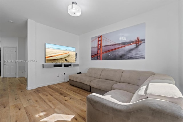 living room with light hardwood / wood-style flooring