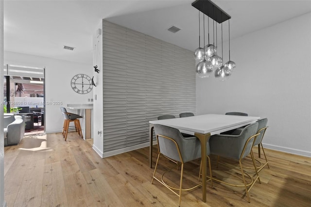 dining space featuring light hardwood / wood-style floors