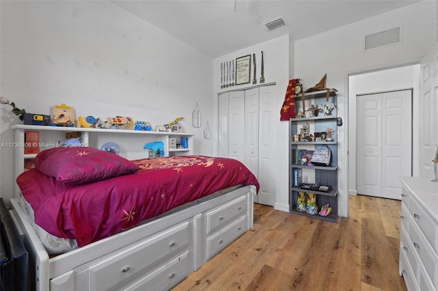 bedroom featuring a closet and light hardwood / wood-style flooring