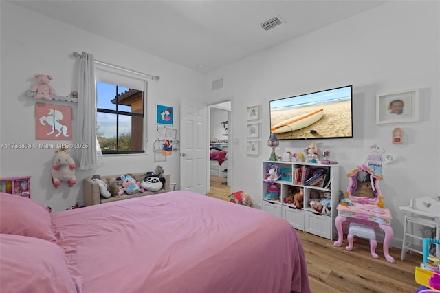 bedroom with light wood-type flooring