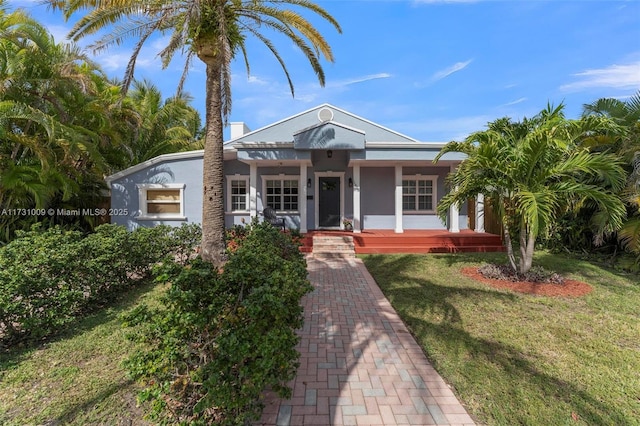 view of front of house featuring a porch and a front yard