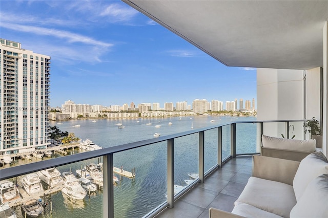 balcony featuring a water view