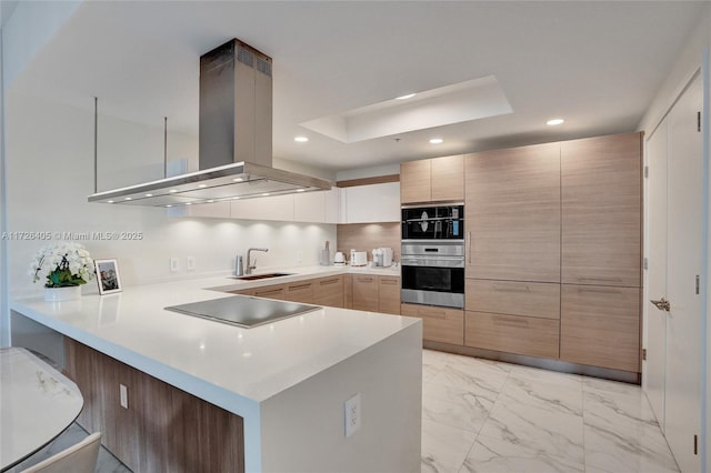 kitchen with double oven, sink, island exhaust hood, kitchen peninsula, and black electric cooktop