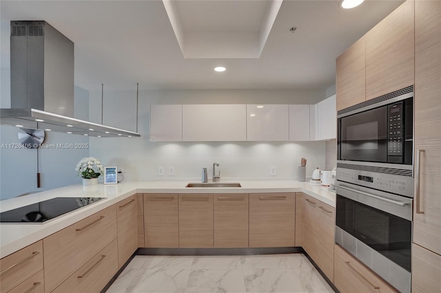 kitchen featuring built in microwave, sink, stainless steel oven, black electric cooktop, and island exhaust hood