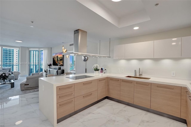 kitchen with white cabinetry, sink, kitchen peninsula, light brown cabinets, and black electric cooktop