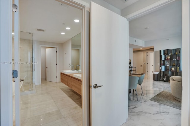 bathroom featuring vanity and walk in shower